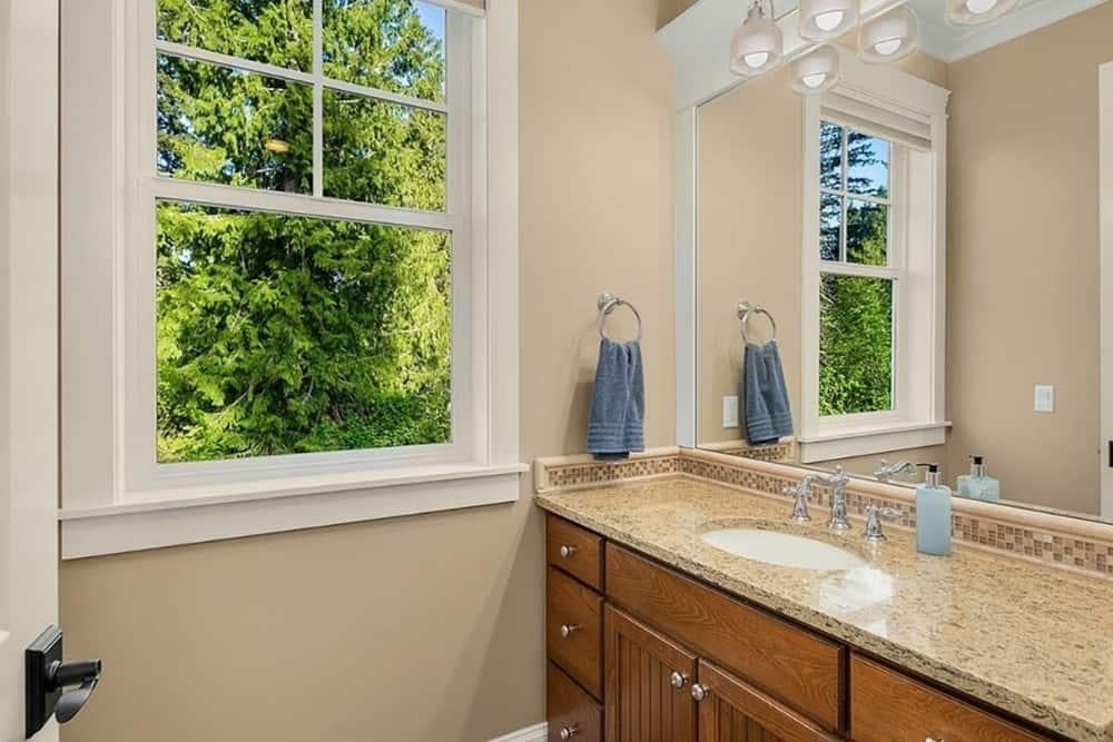 Enjoy the Woodland View from This Timeless Bathroom