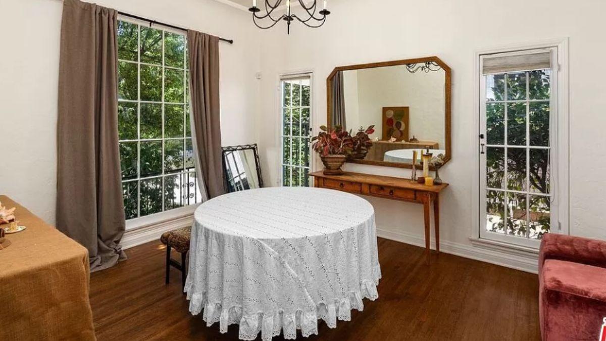 Notice the Large Mirror Reflecting Light in This Dining Room