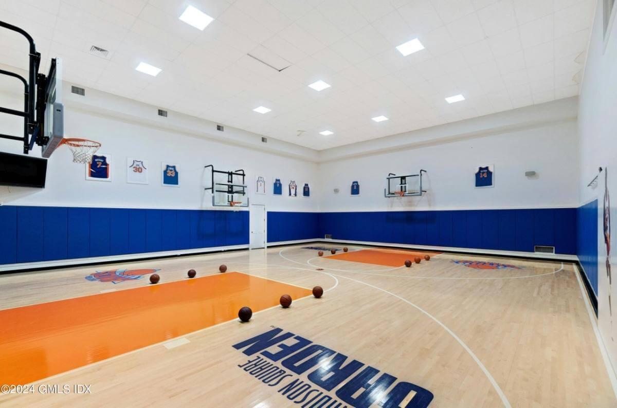 Check Out the Indoor Basketball Court with Iconic Team Accents