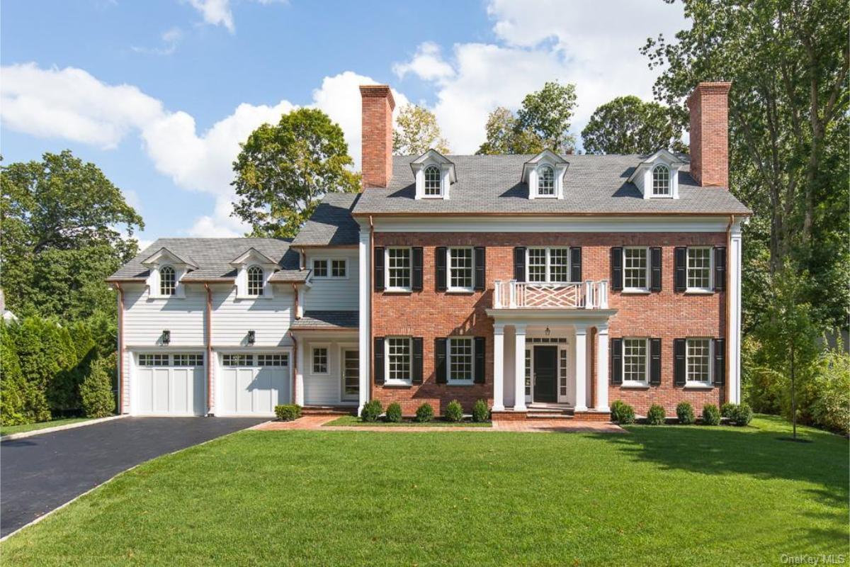 Classic Colonial Charm with Impeccable Brickwork and Dormer Windows