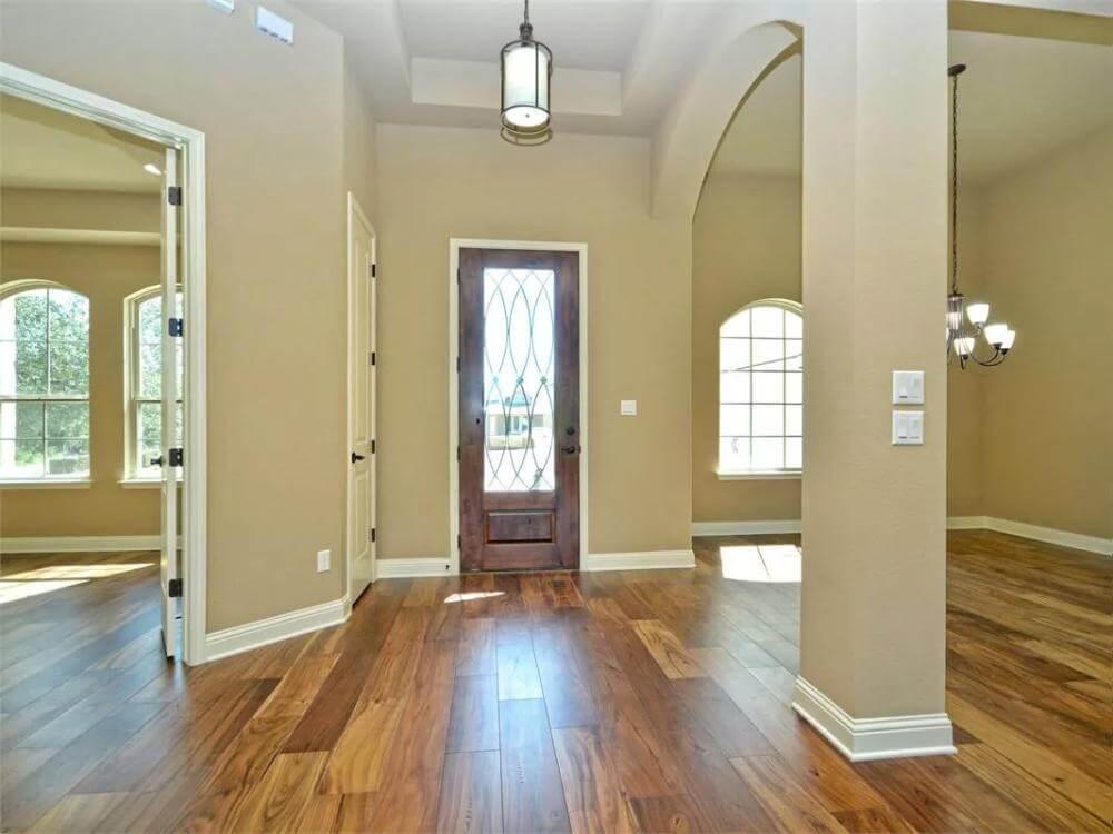 Welcome Home to a Bright Entryway with Arched Doorways