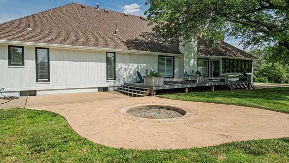 Check Out the Cozy Fire Pit in This Expansive Backyard