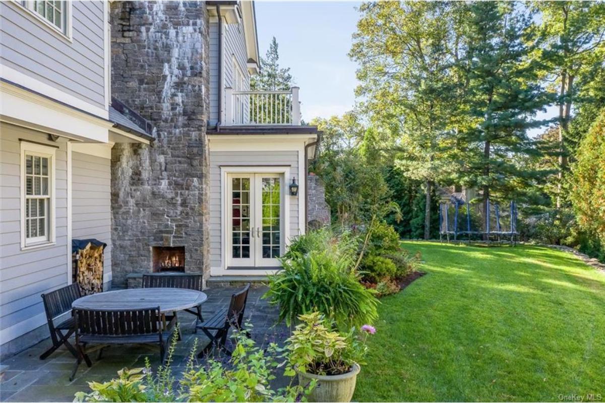 Charming Patio Retreat with Stone Fireplace