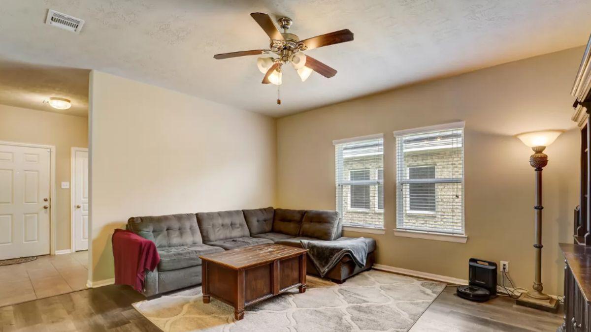 Cozy Living Room with a Relaxed Vibe and Practical Ceiling Fan