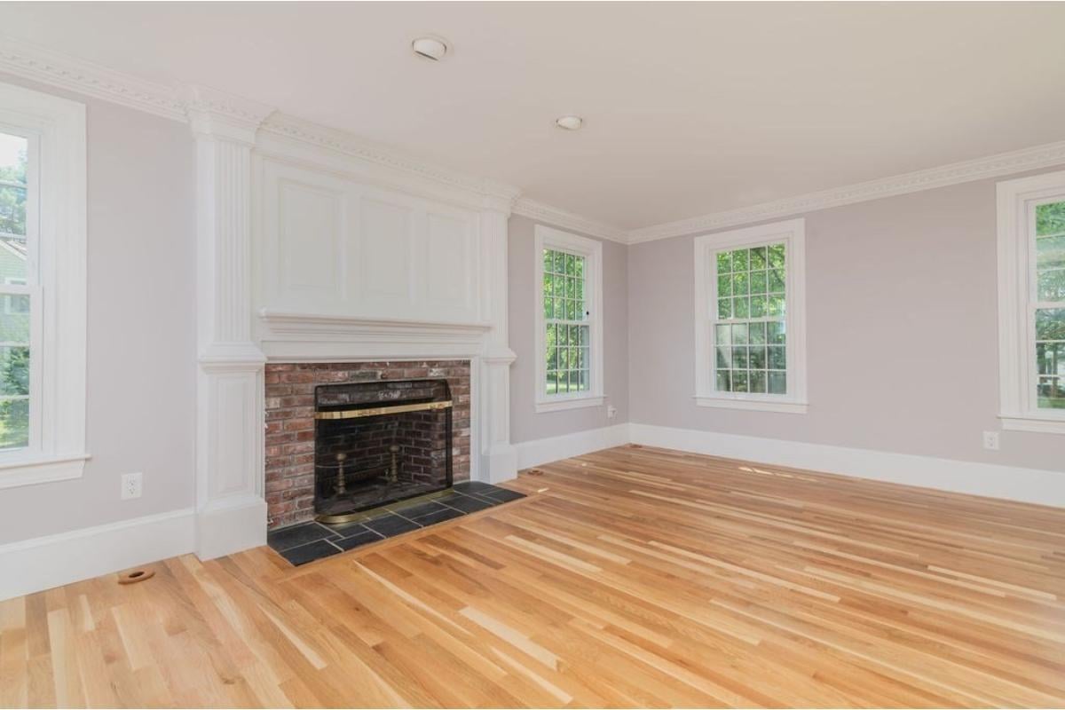 Classic Living Room with Brick Fireplace and Crown Molding Details