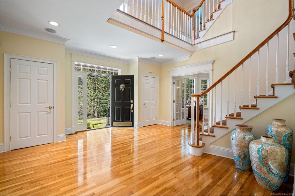 Step Into This Elegant Foyer with a Grand Staircase