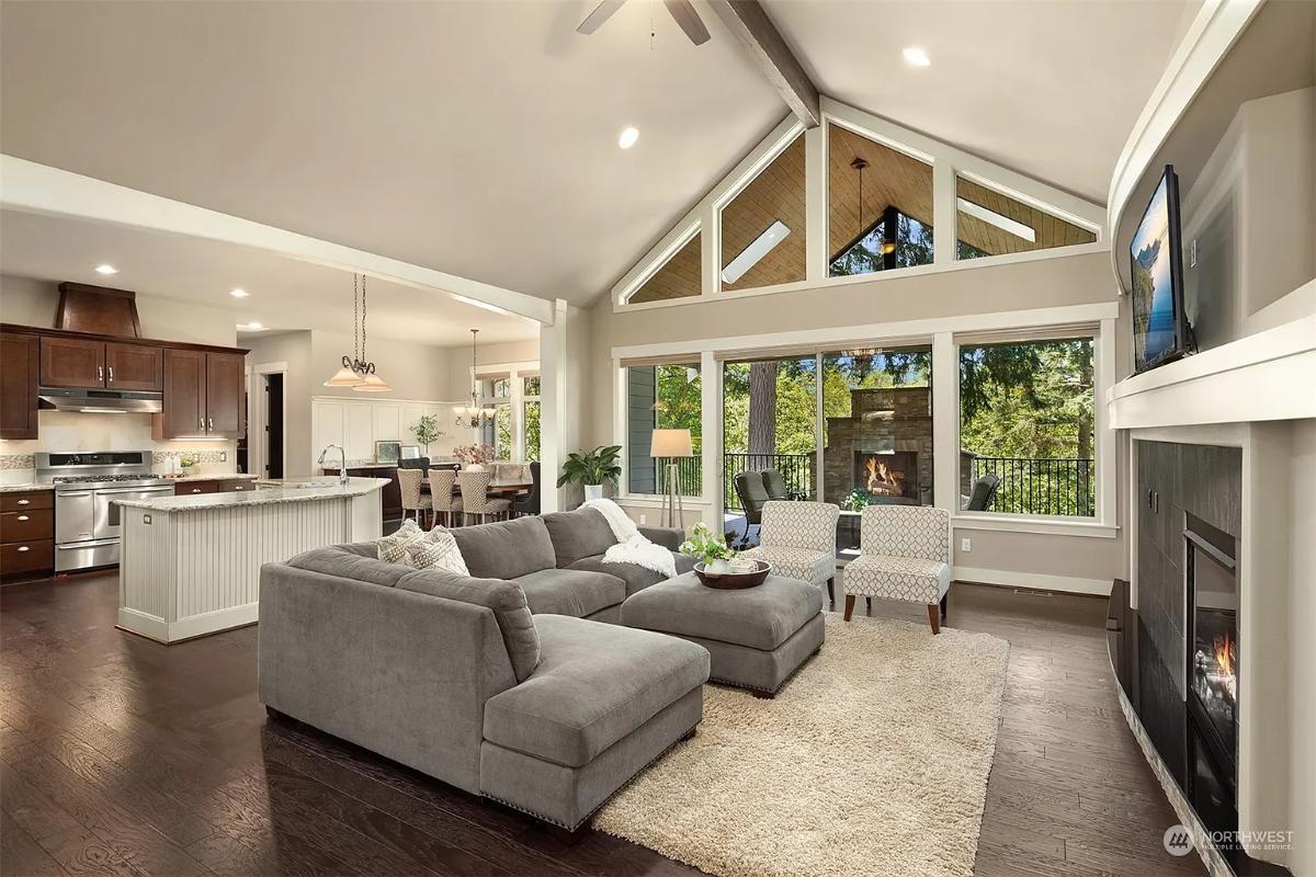 Open Living Room with Vaulted Ceiling and an Inviting Fireplace Backdrop