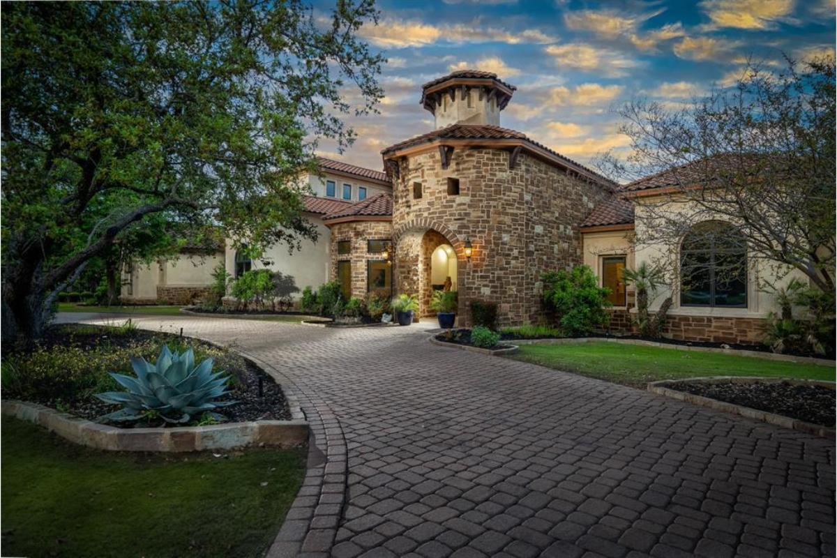 Tuscan-Inspired Entry with Distinctive Stone Tower