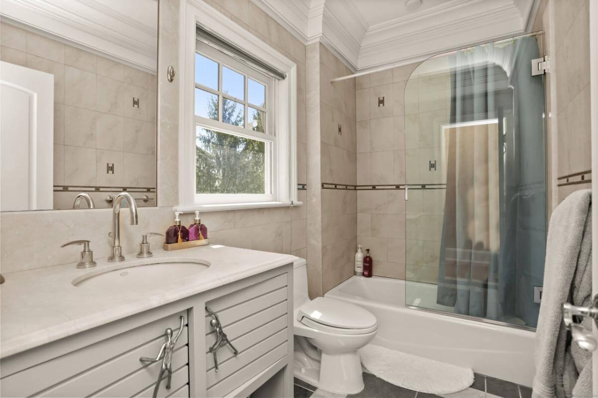 Notice the Elegant Trim Work in This Refined Bathroom