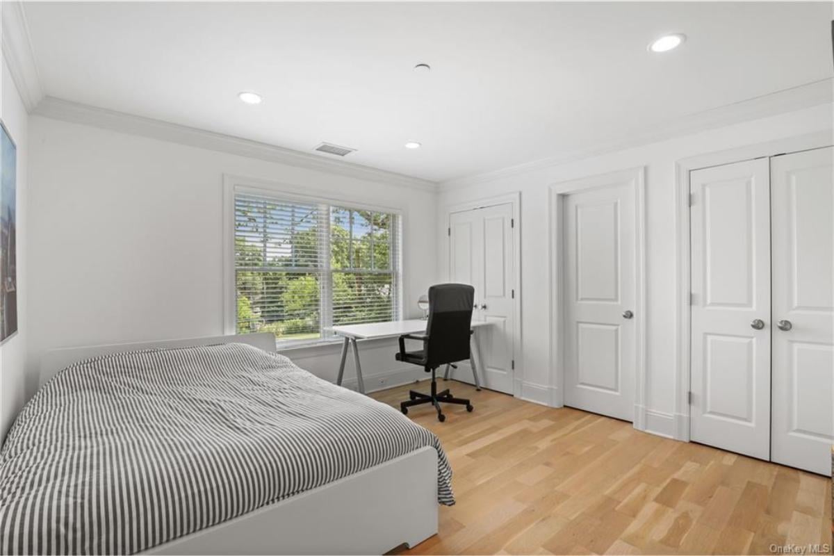 Simple Bedroom with a Built-In Study Nook That Catches the Eye