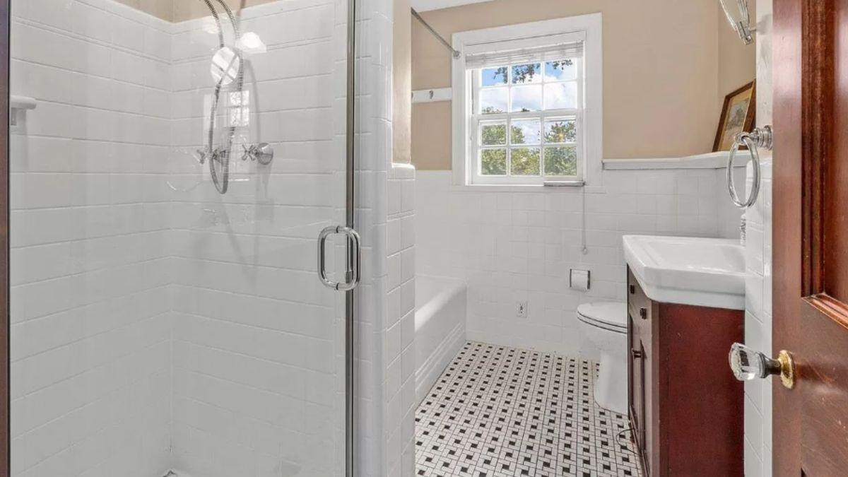 Elegant Bathroom with Timeless Black and White Tile Flooring