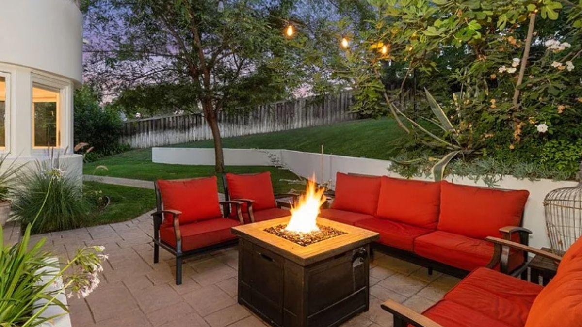 Feel the Warm Embrace of This Evening Patio with a Fire Pit