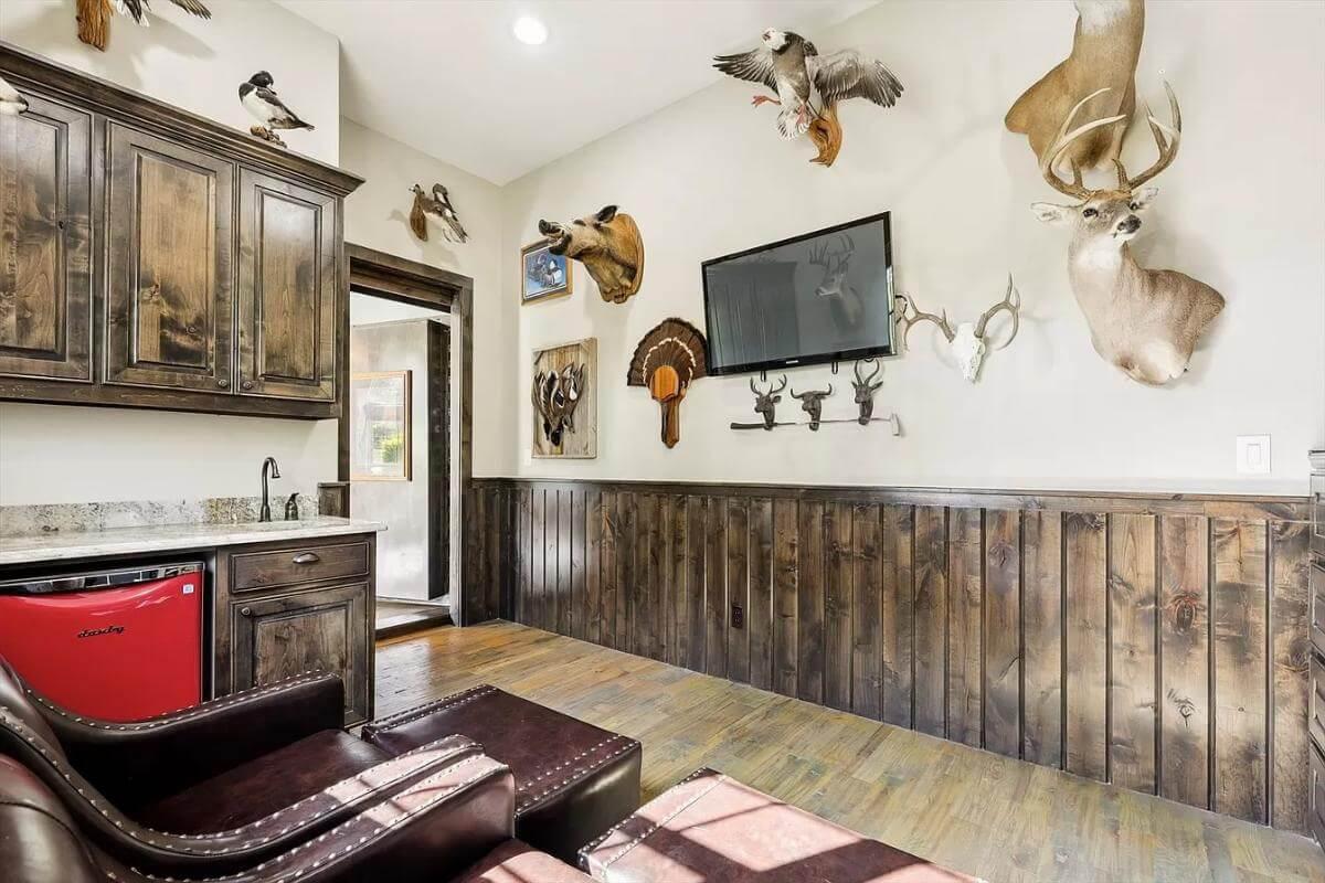 Rustic Lounge with Unique Taxidermy Display and Warm Wood Accents