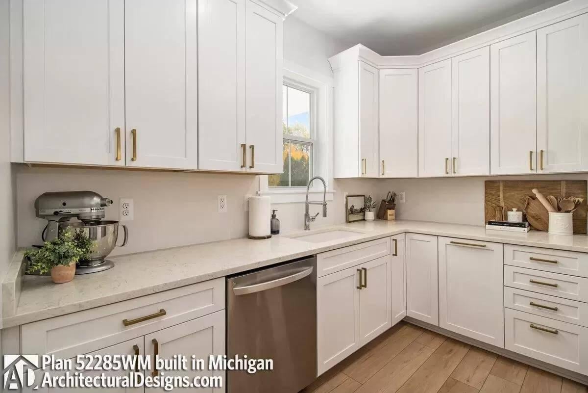 Efficient Farmhouse Kitchen with a Modern Spin and Brass Accents