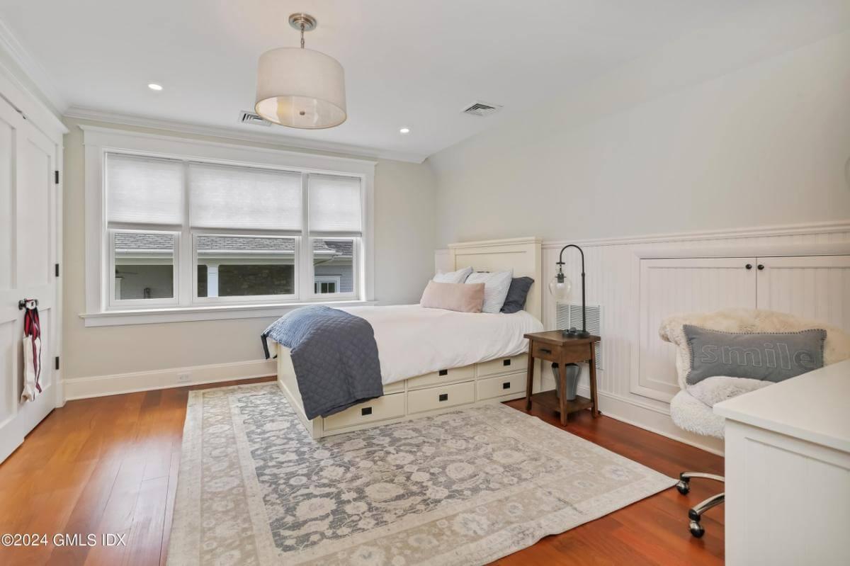 Discover This Light-Filled Craftsman Bedroom with a Cozy Reading Chair