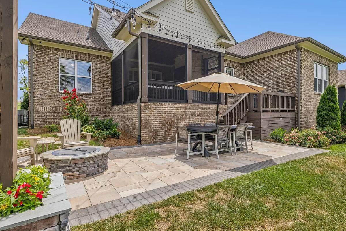 Enjoy This Expansive Patio with Fire Pit and Screened Porch Combo