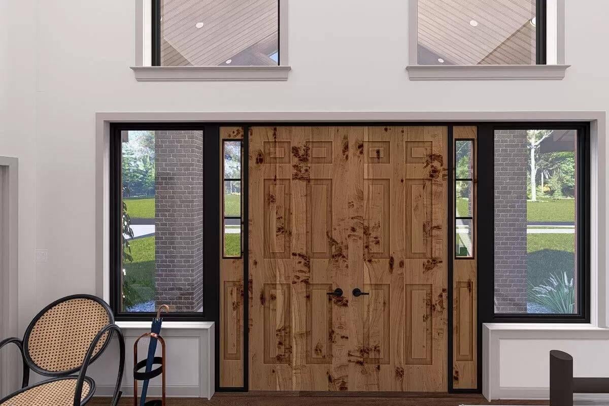 A Grand Entrance with Knotty Wood Accents and Tall Sidelights