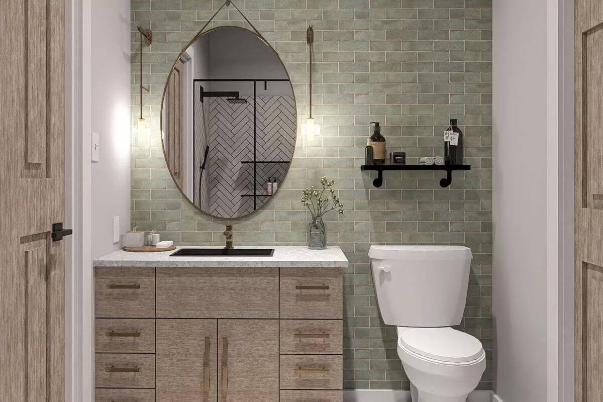 Thoughtful Bathroom Design with a Striking Oval Mirror and Brass Accents