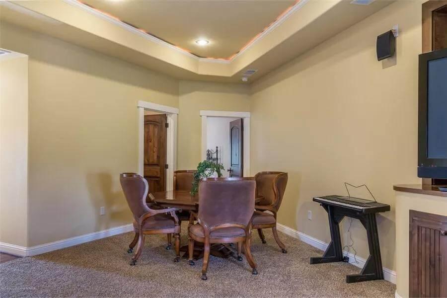 Intimate Game Nook with Cozy Leather Chairs and Warm Lighting