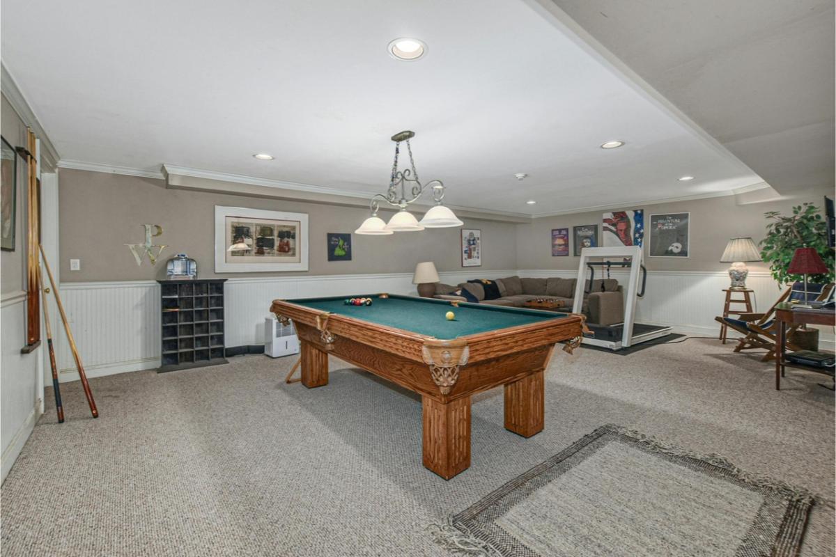 Check Out This Inviting Basement with a Classic Pool Table