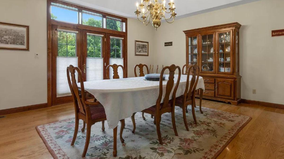Classic Dining Room with Elegant Draperies and Grand China Cabinet