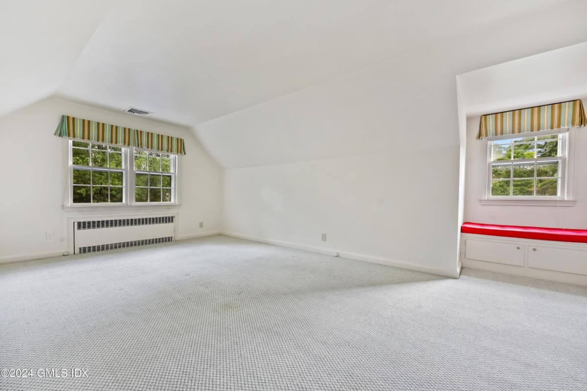 Spacious Bonus Room Featuring a Cozy Window Seat