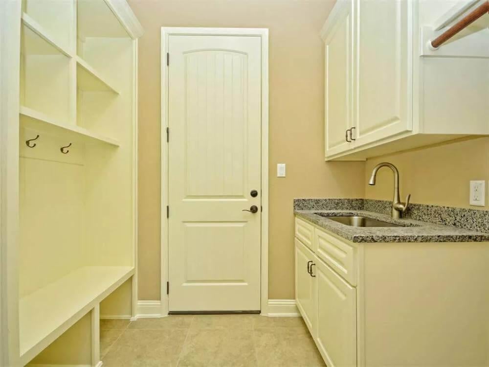 Tidy Utility Room with Convenient Built-In Bench and Storage