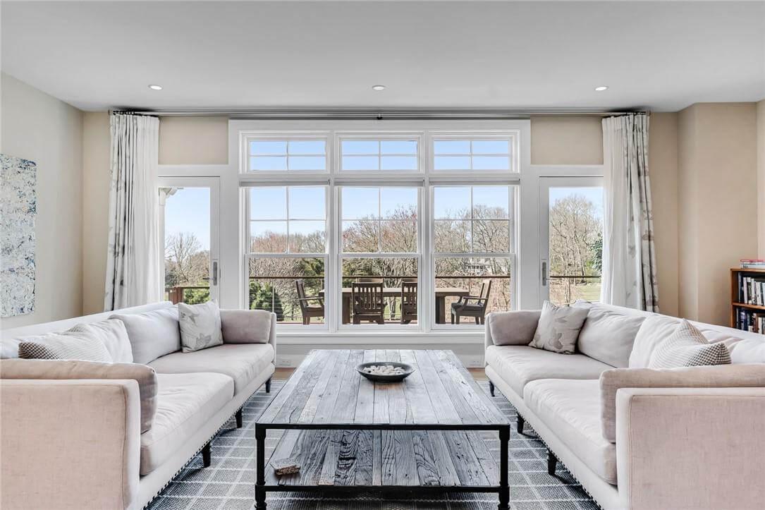 Sleek Living Room with Expansive Windows Overlooking Scenic Views
