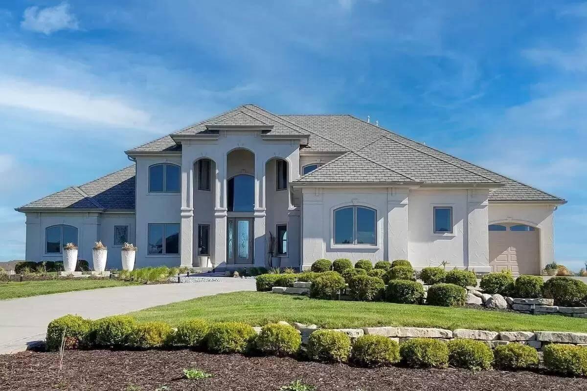Marvel at the Arched Double-Height Windows Framing This Stately Facade