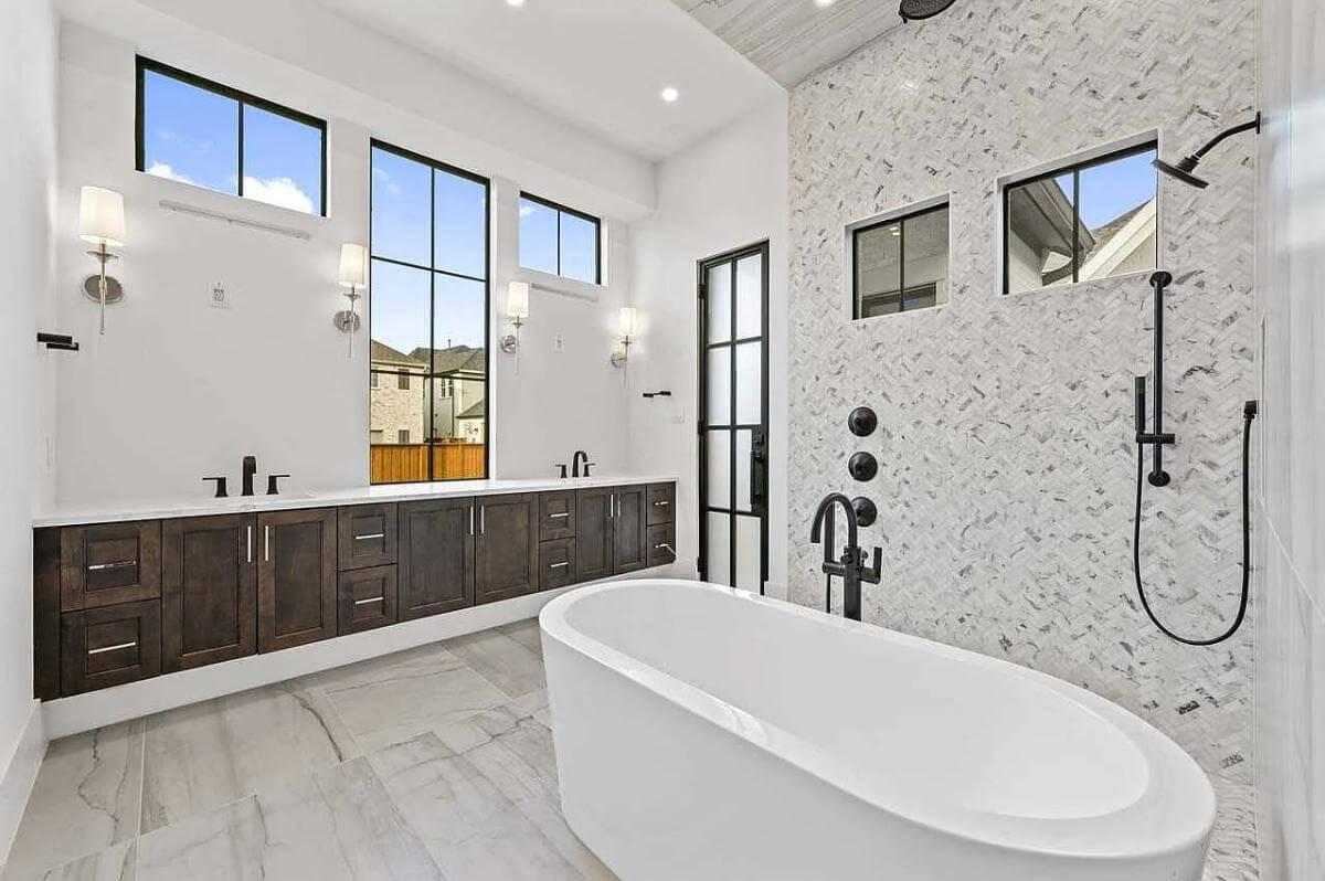 Check Out the Freestanding Tub and Chevron Tile in This Bright Bathroom