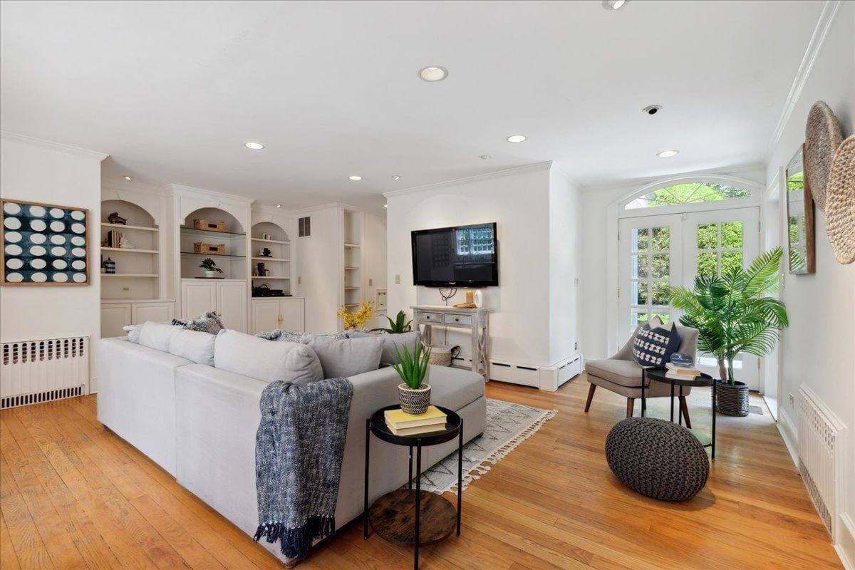 Sunlit Living Space with Built-in Shelving and Garden Views