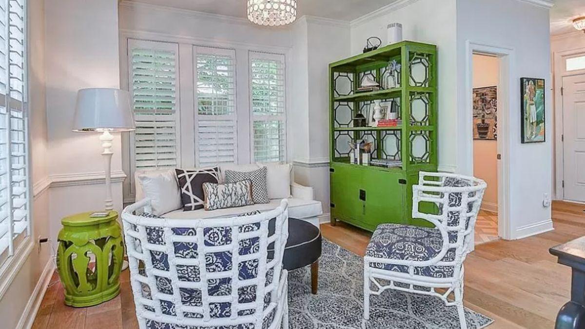 Vibrant Living Area with a Pop of Green and Intricate Seating