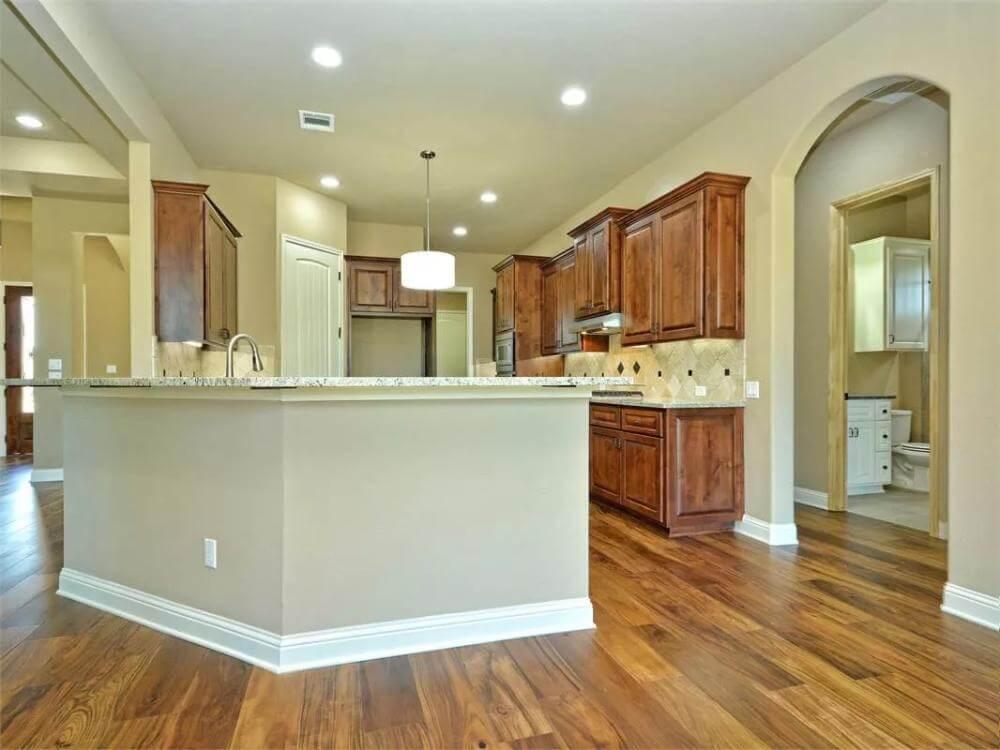 Kitchen with Warm Wood Floors and Spacious Peninsula