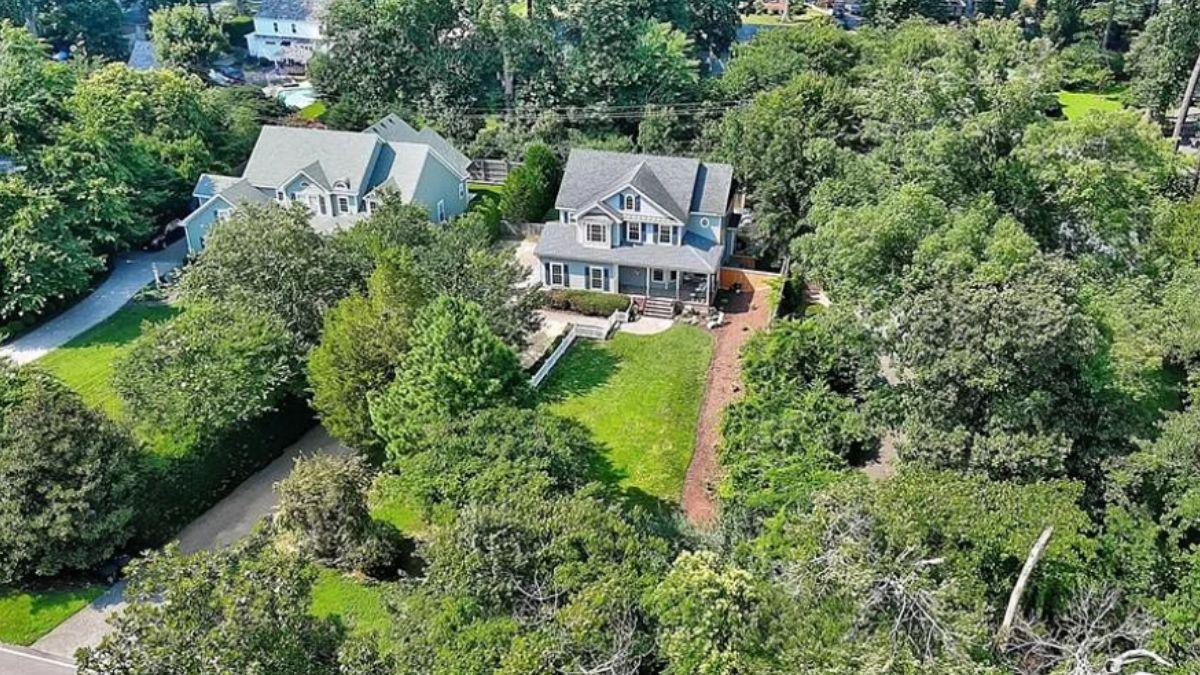 Aerial View of Craftsman Home Nestled in Verdant Surroundings