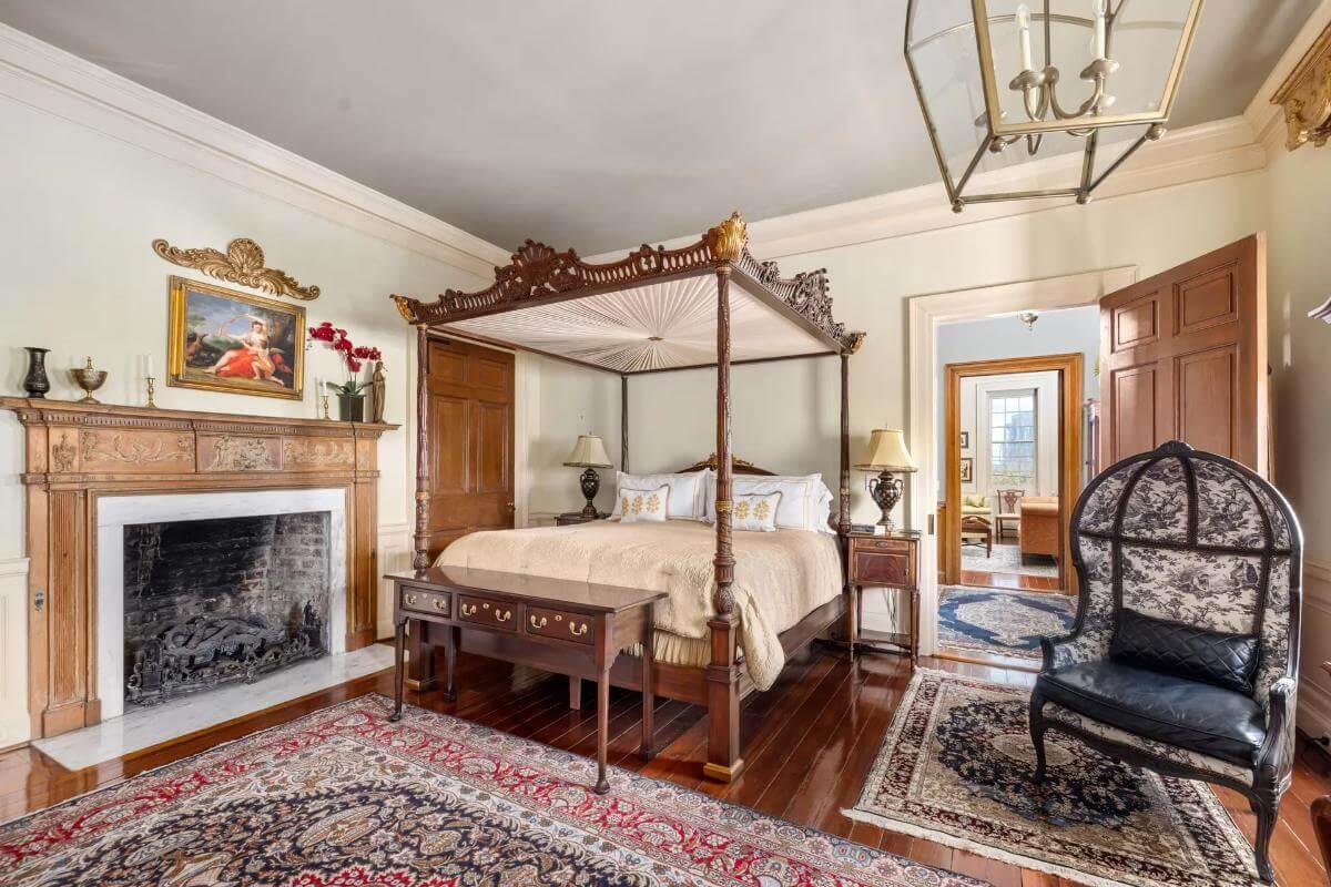 Regal Bedroom with Ornate Canopy Bed and Elegant Fireplace Mantel