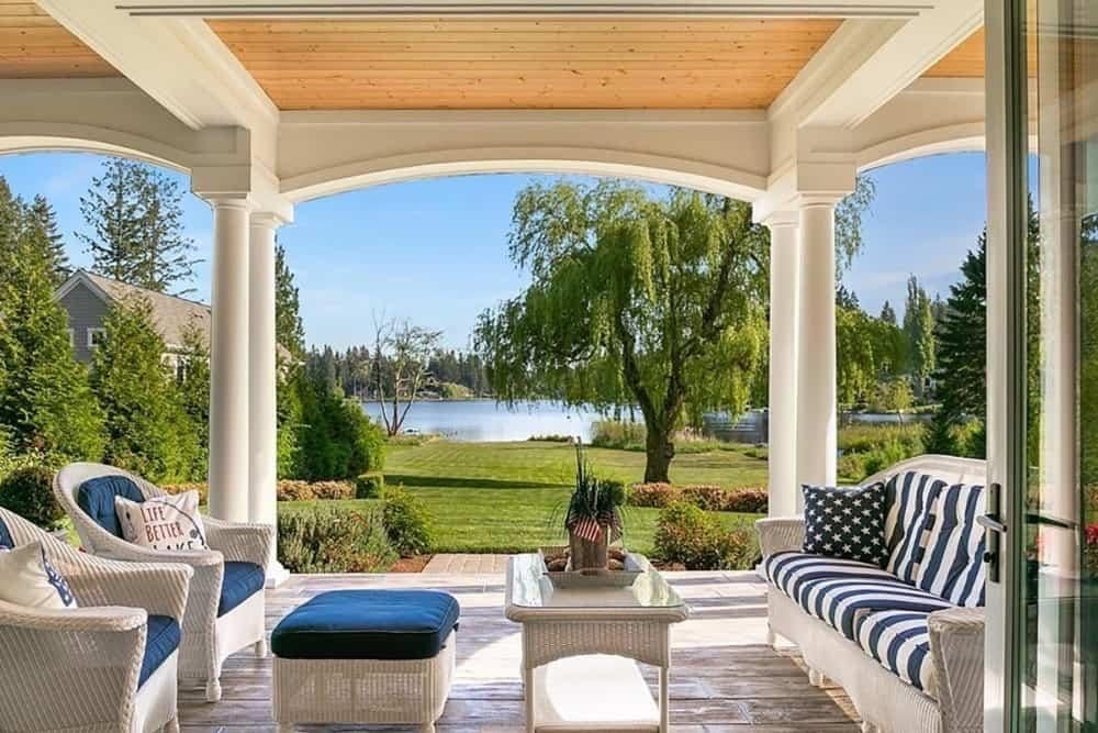 Take in the Scenic Lake View from This Elegant Covered Patio