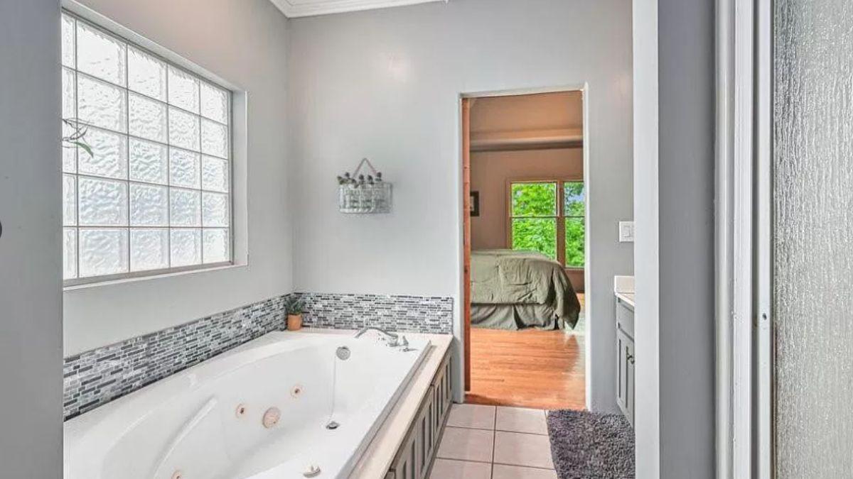 Relax in This Bright Bathroom with Spa-Style Jet Tub