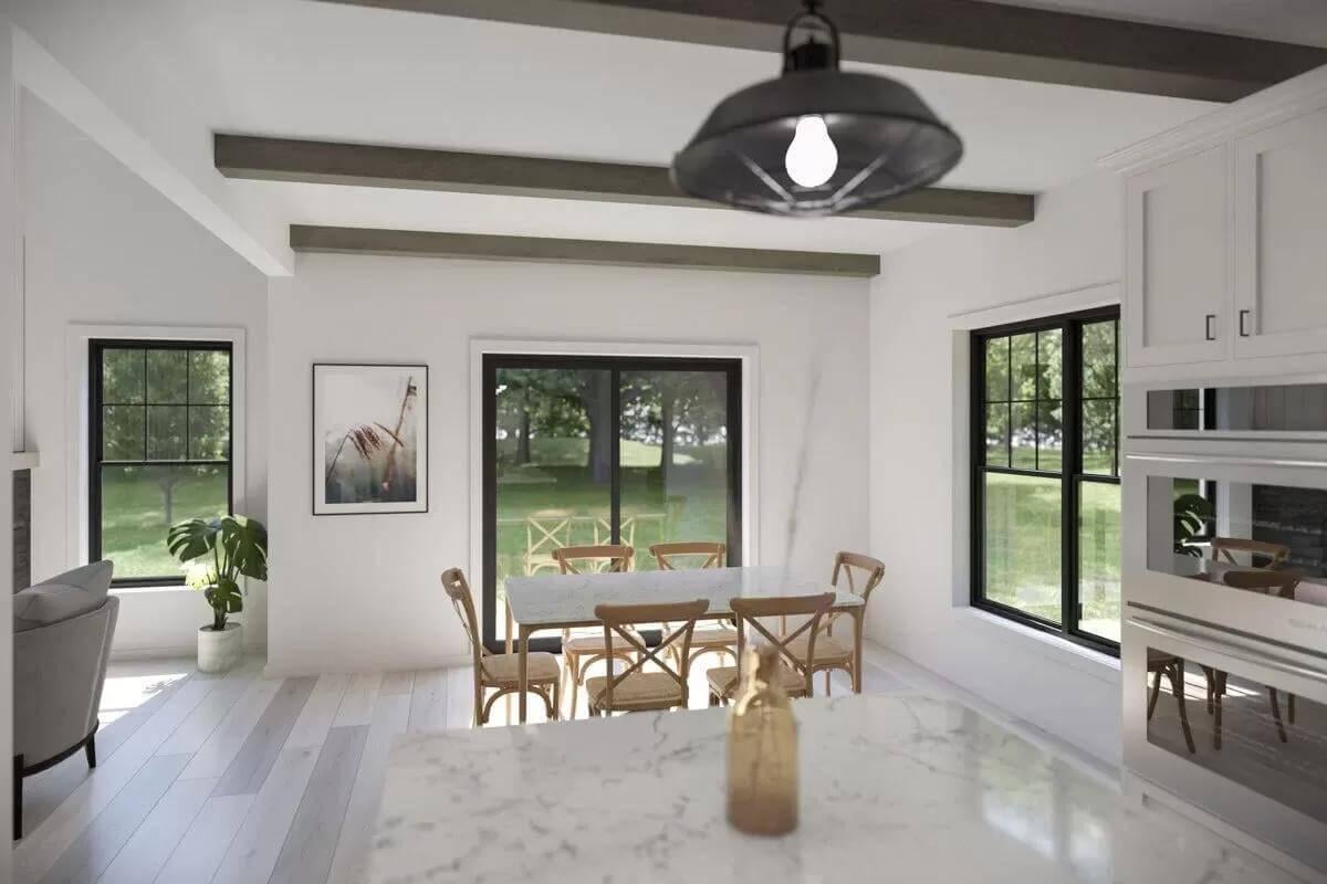 Inviting Dining Space with Beamed Ceilings and Garden Views