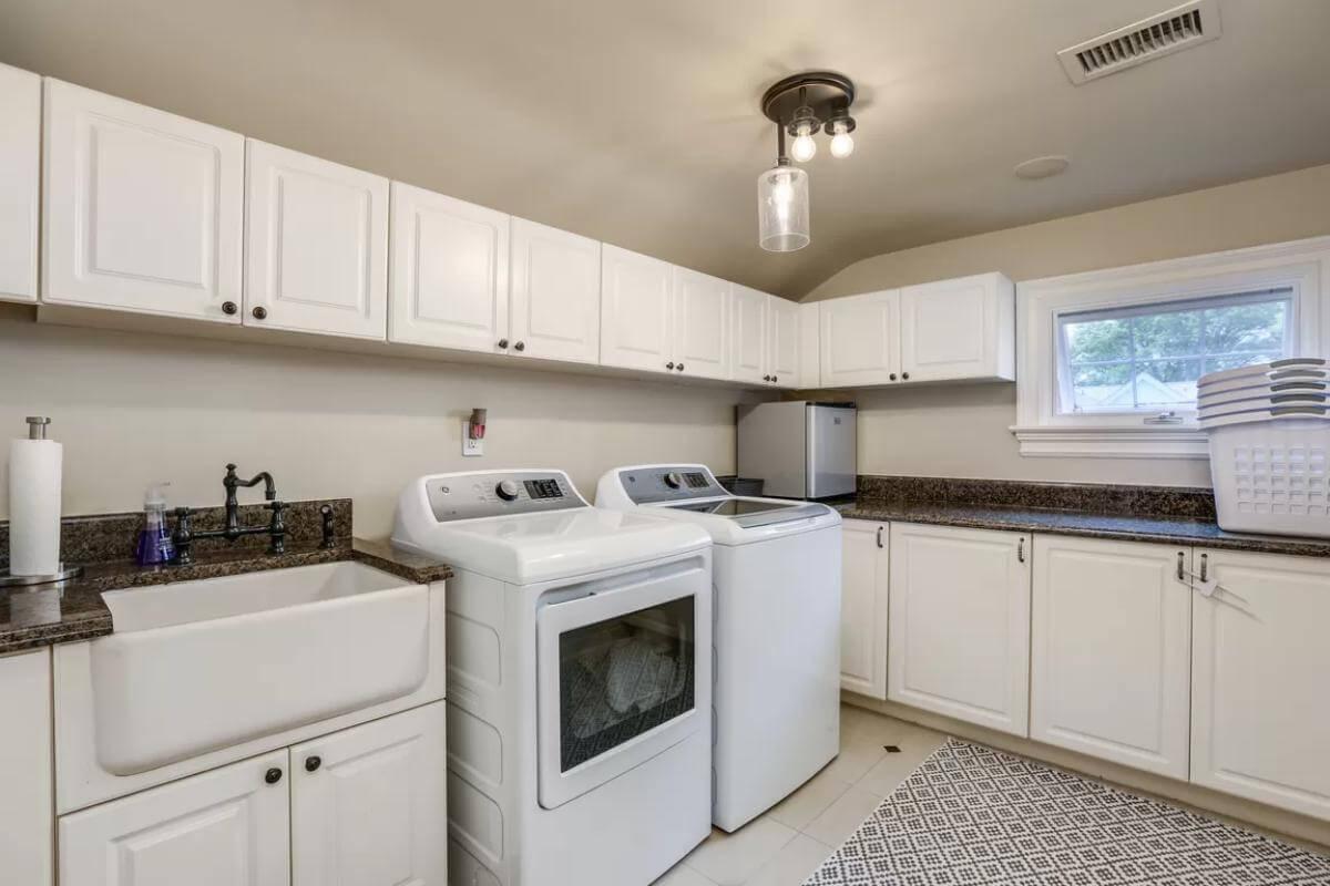 Efficient Laundry Room with Vintage Farmhouse Sink