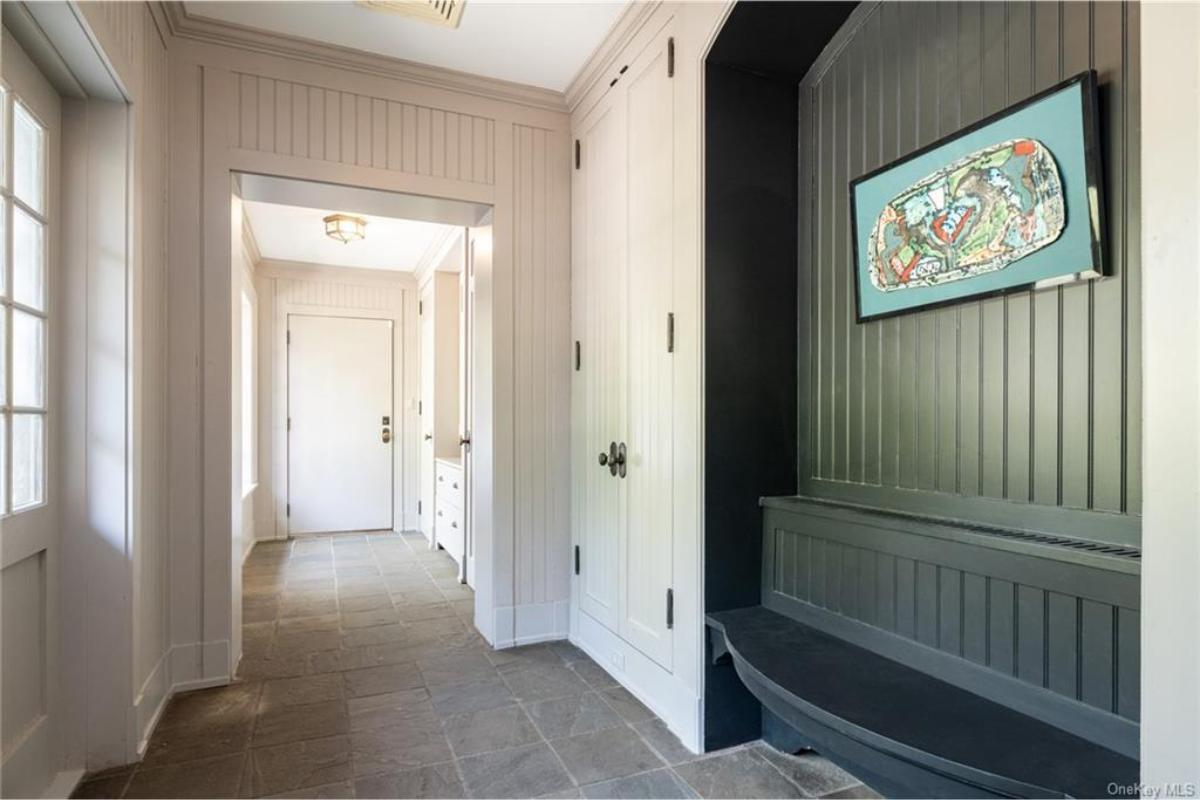 Notice the Built-In Bench in This Practical Mudroom with Tongue-and-Groove Walls