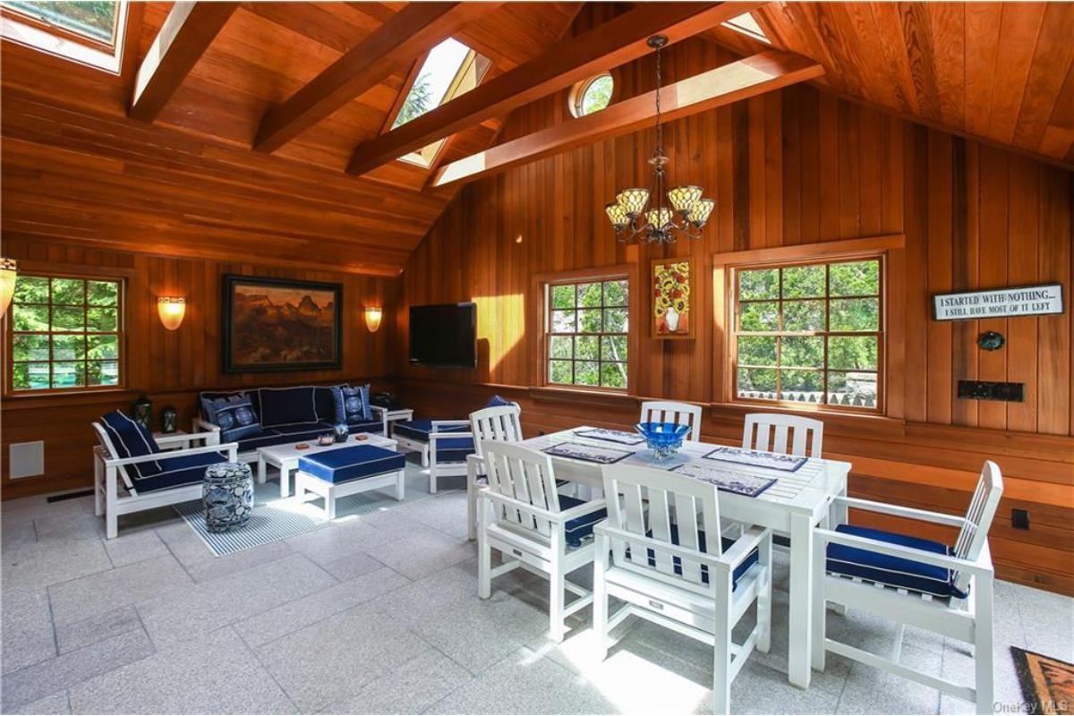 Notice the Warm Wood Paneling in This Inviting Sunroom