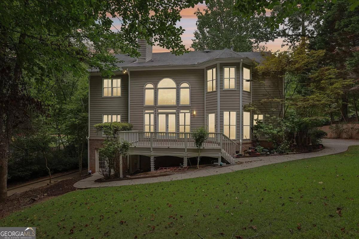 Discover the Bay Windows and Deck on This Woodland Retreat