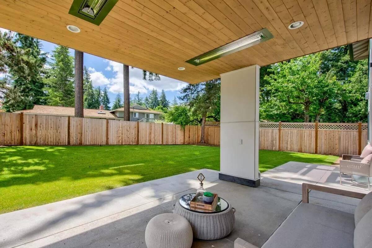 Relax Under the Natural Wood Ceiling on This Inviting Patio