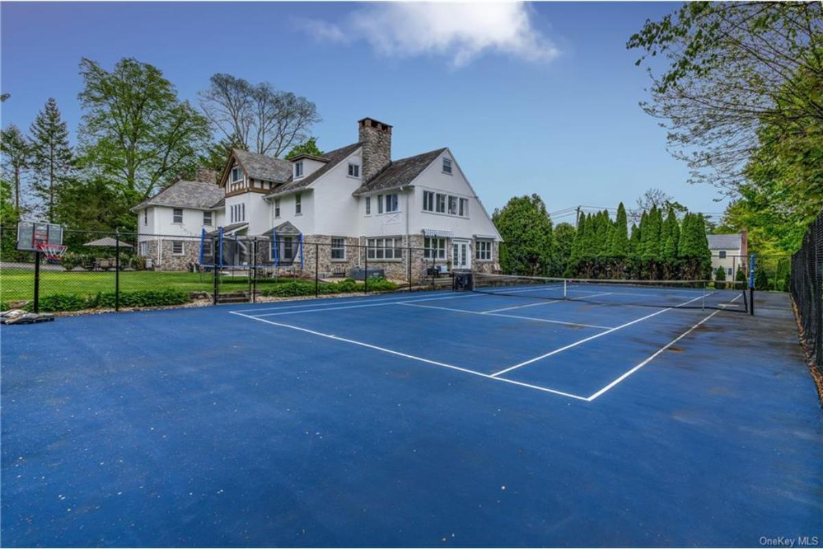 Check Out the Spacious Tennis Court Paired with Classic Architecture