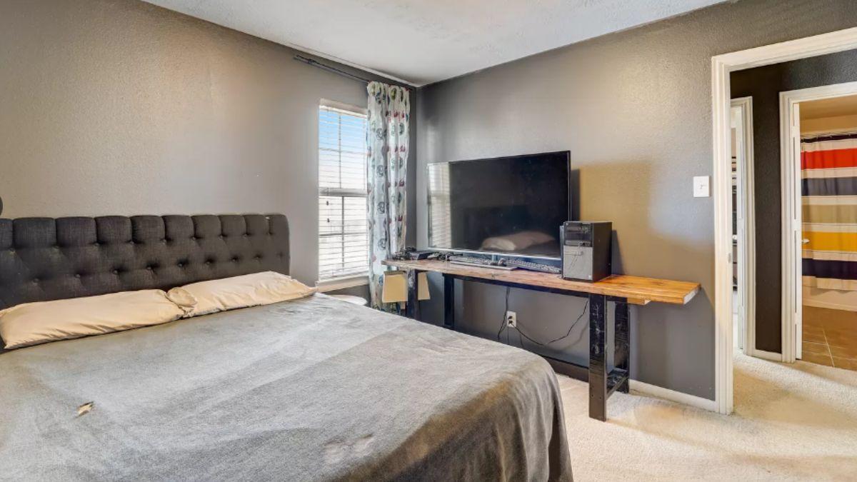 Simple Bedroom with Industrial Touches and a Media Setup