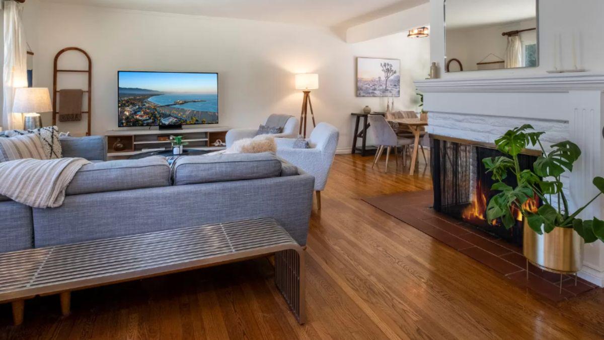 Cozy Living Room with Mid-Century Touch and Cheery Fireplace
