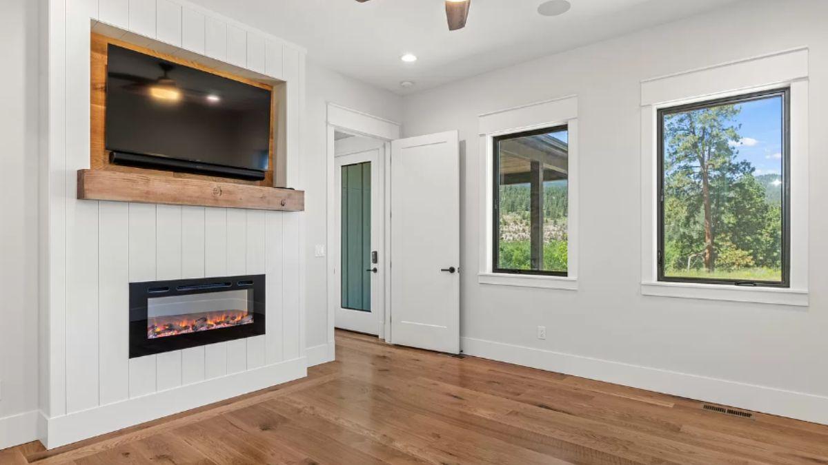 Notice the Clean Lines and Modern Fireplace in This Versatile Room