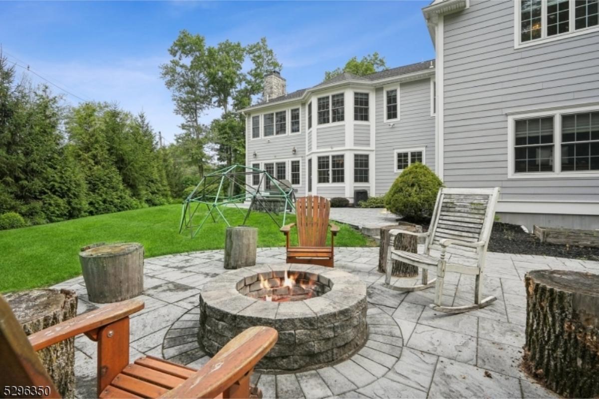 Backyard Retreat with a Cozy Fire Pit and Rocking Chairs