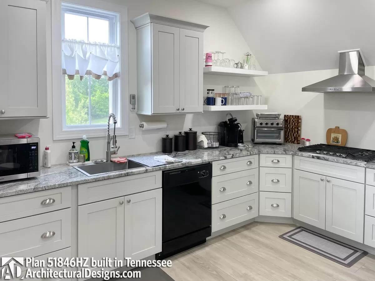 Chic White Kitchen with Open Shelving for a Personal Touch