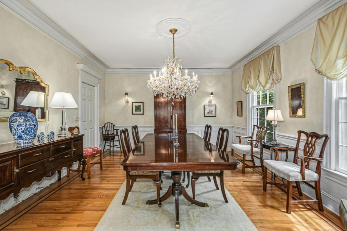 Take in the Grandeur of This Dining Room with Its Glass Chandelier